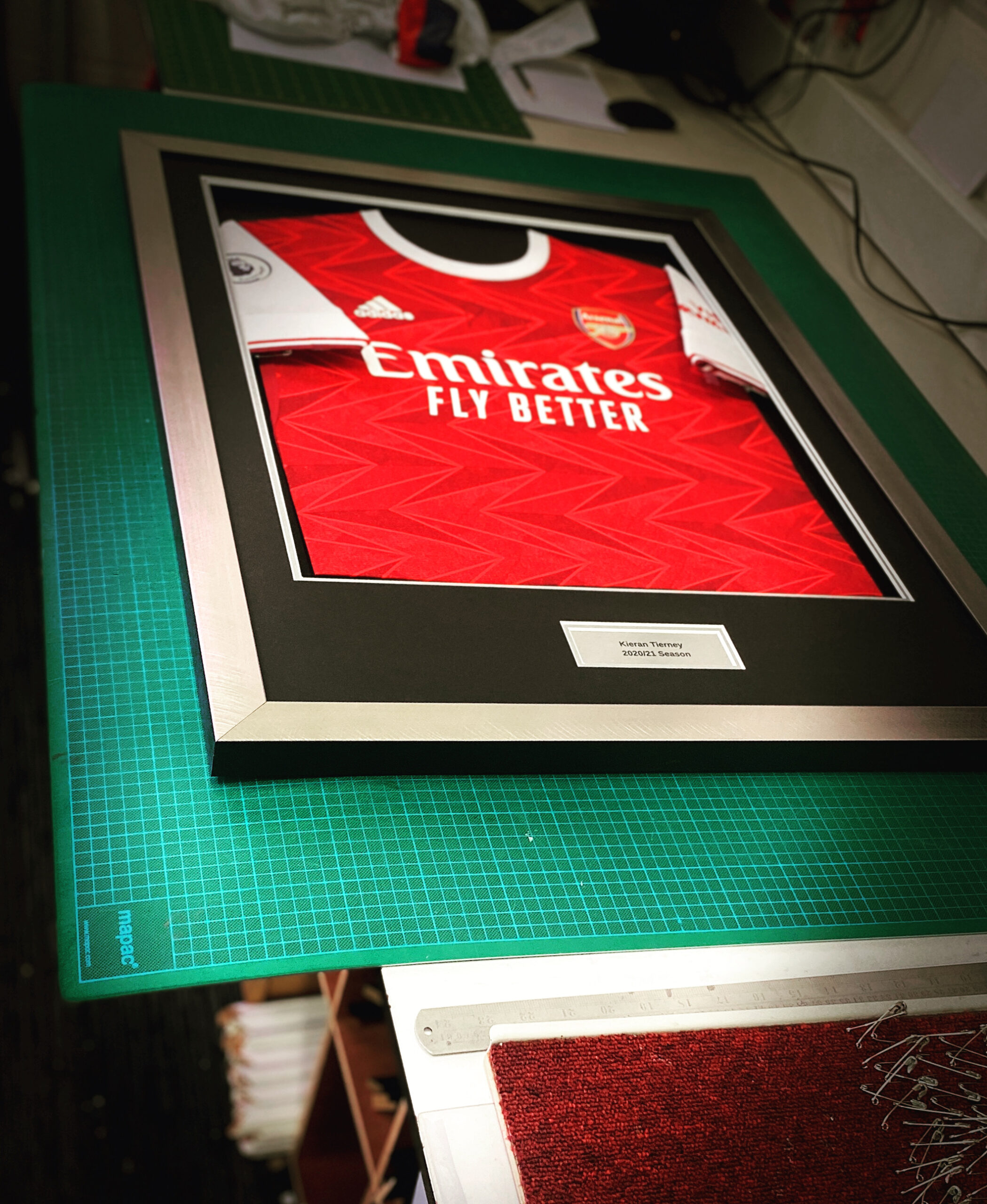 Arsenal football shirt being professionally framed